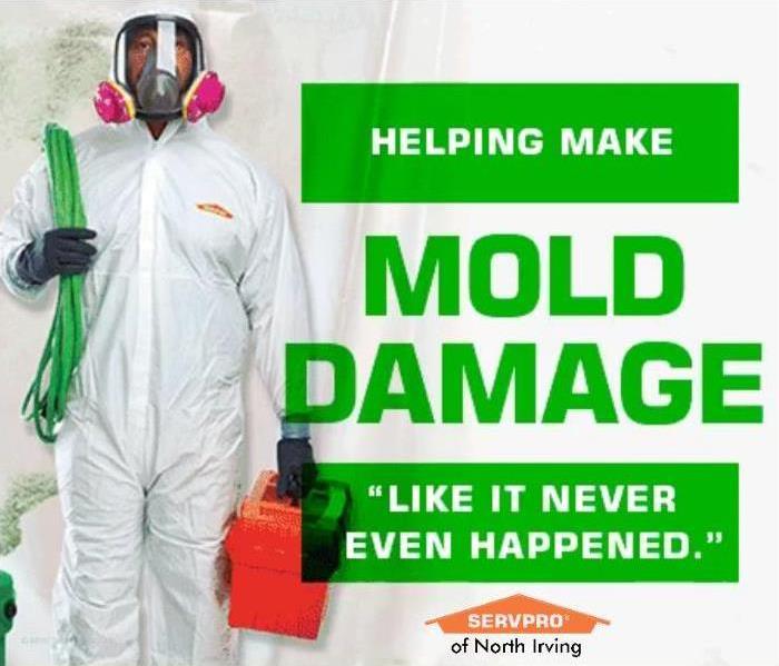 SERVPRO technician in white coveralls with a full-face mask
