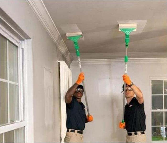 Two men restoring ceiling in Dallas